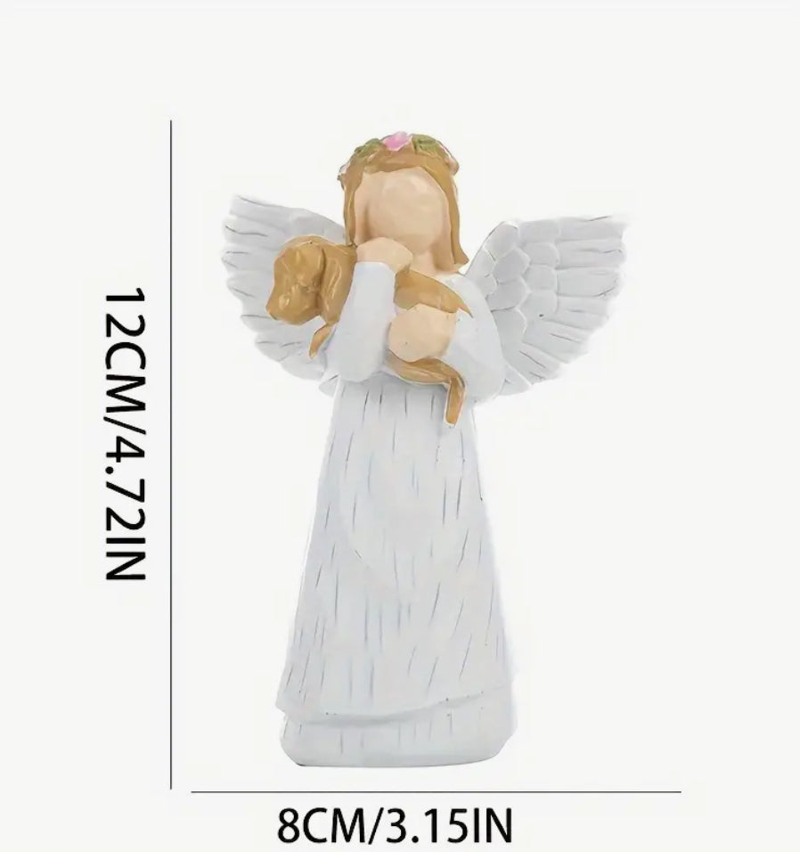 Angel carrying dog figurine