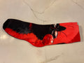 Black cat blowing bubble socks