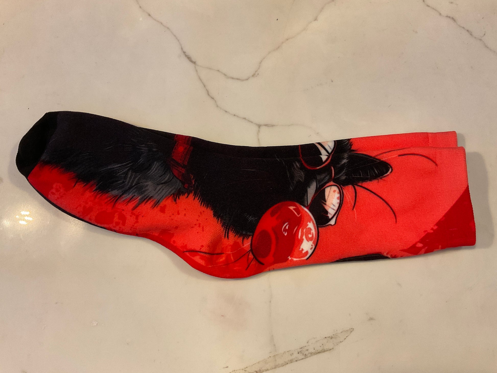 Black cat blowing bubble socks