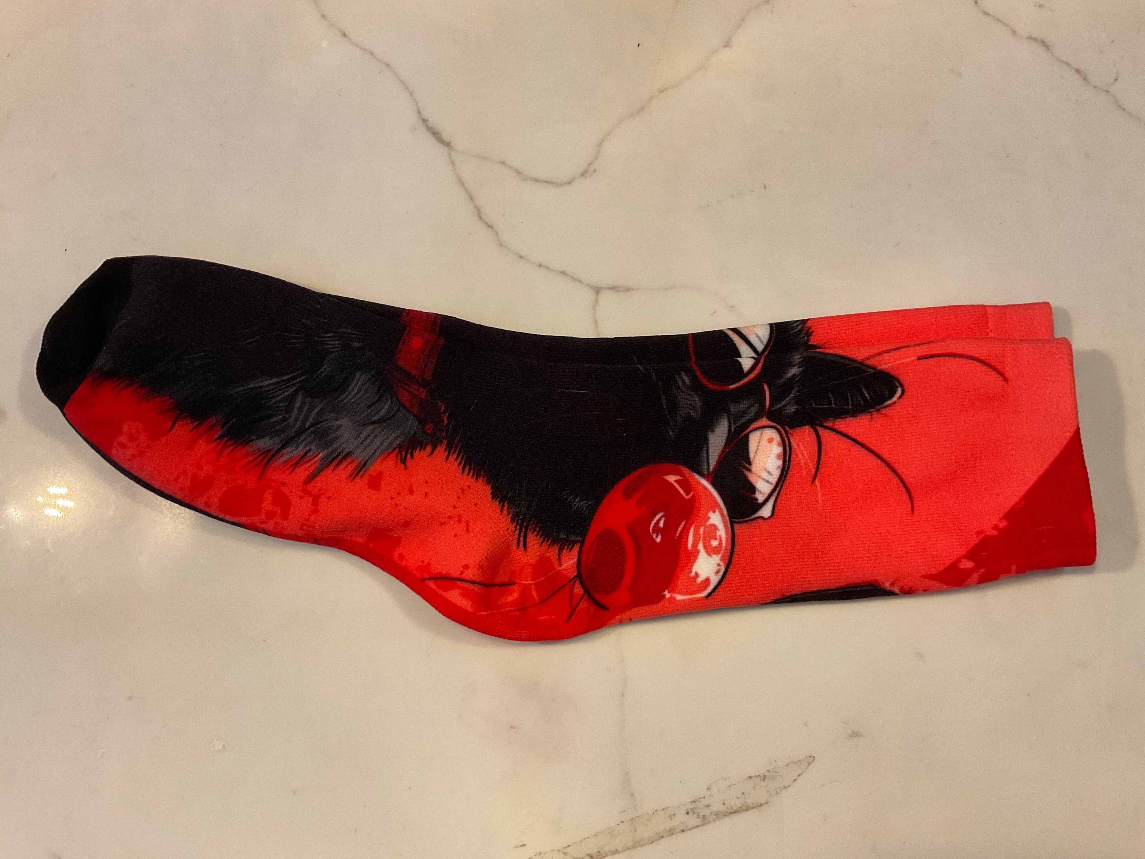 Black cat blowing bubble socks