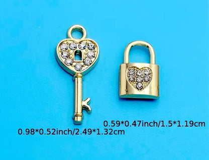 Gold lock and key charms with pink or white diamonte