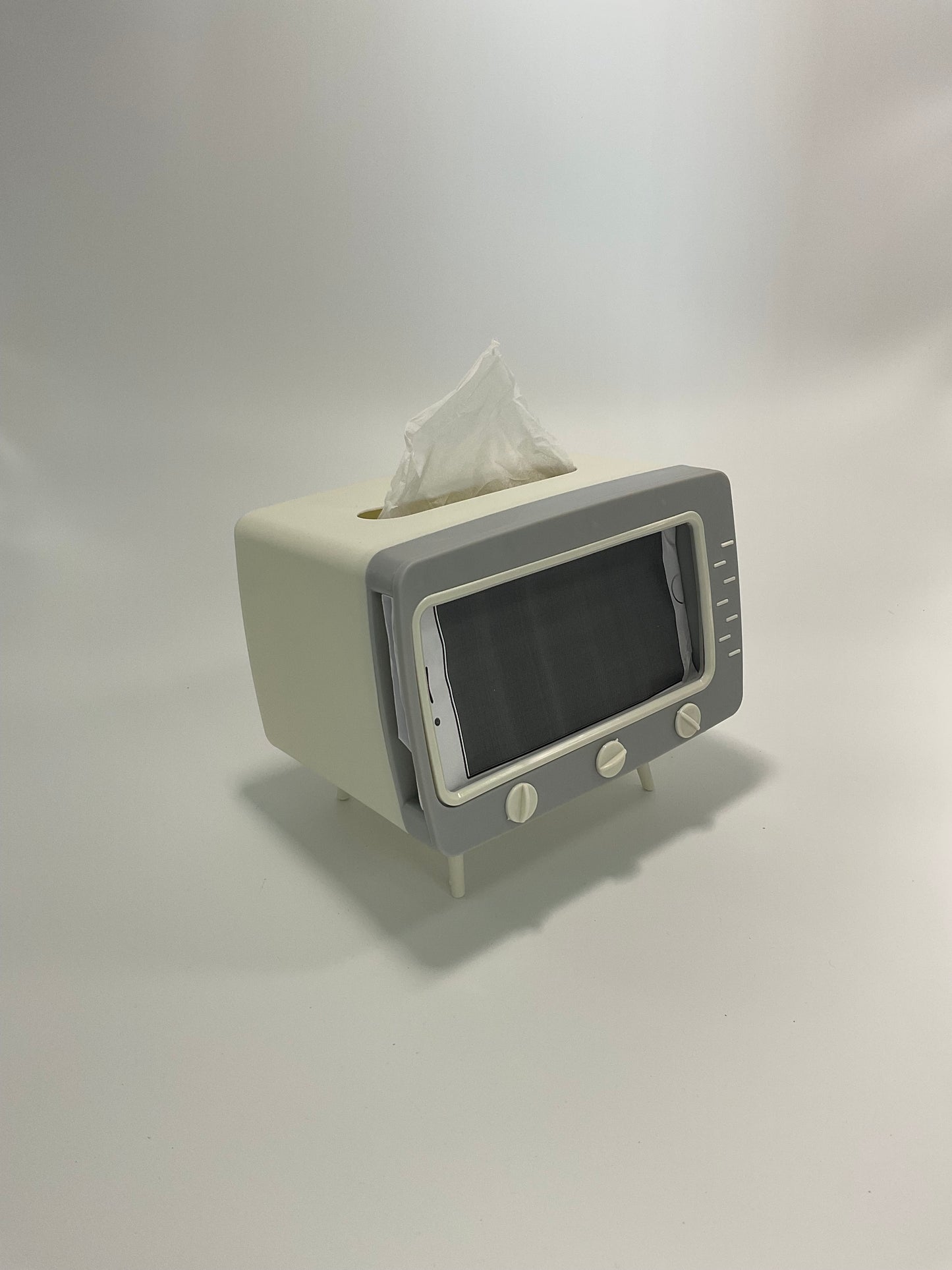 Television tissue holder and mobile phone holder.