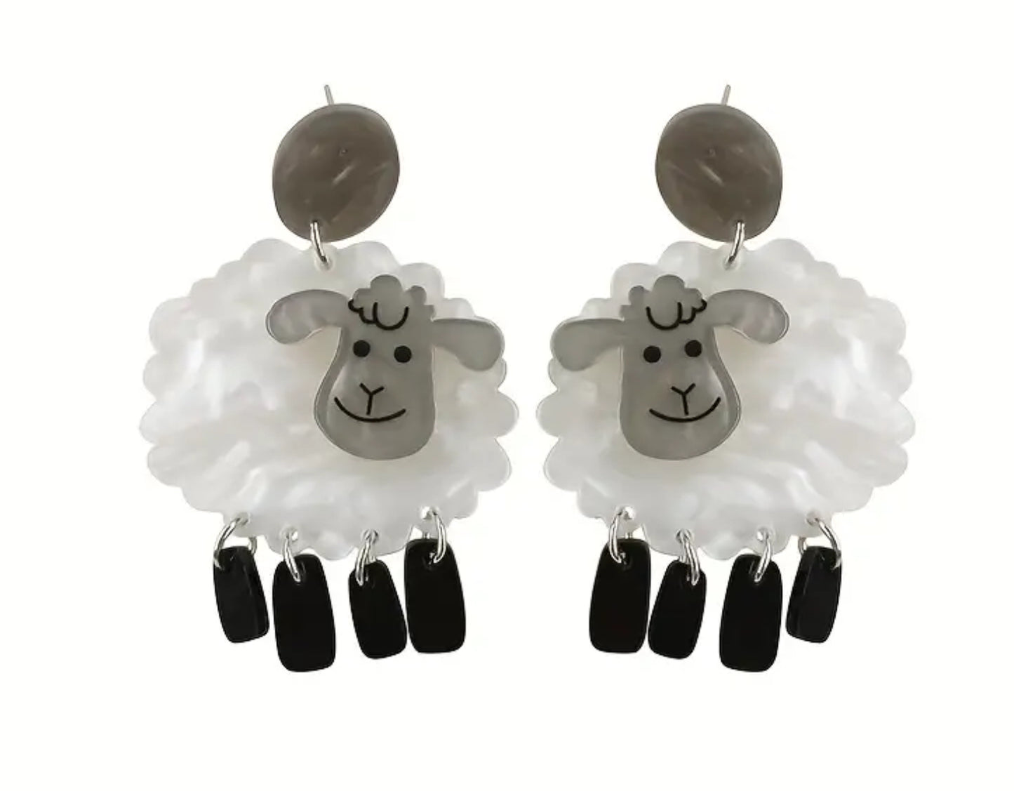 White sheep with dangling black leg earrings