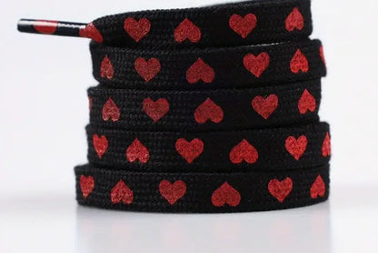 Hearts (white or red) on black shoelaces