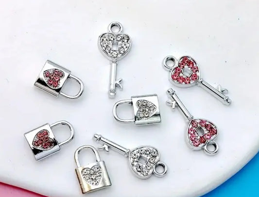 Silver-plated lock and key charms with pink or white diamonte