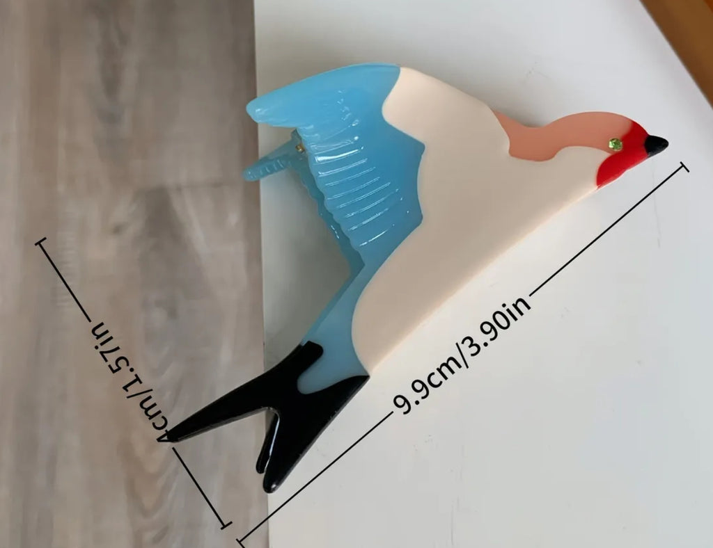 Pince à cheveux en forme de griffe d'oiseau
