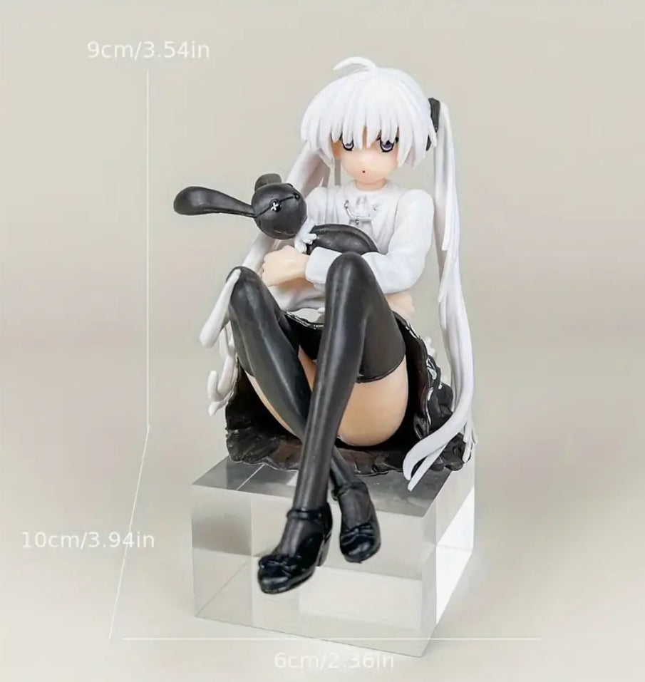 Anime girl sitting with rabbit figurine