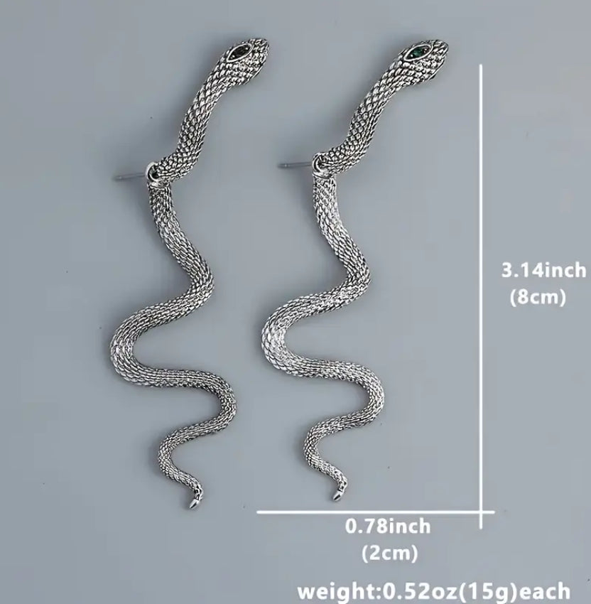 Boucles d'oreilles serpents en or aux yeux noirs