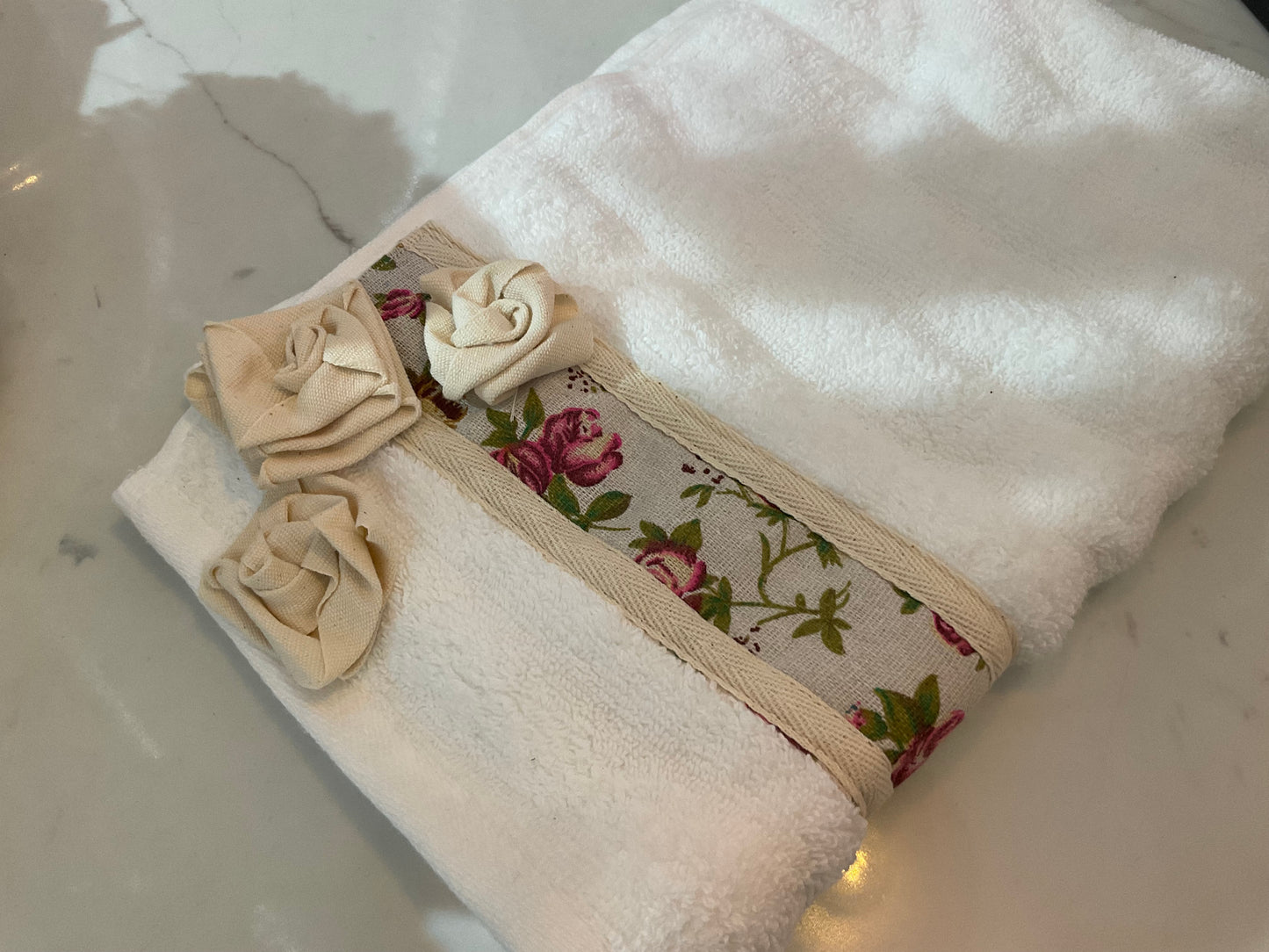 White hand towel with rose details