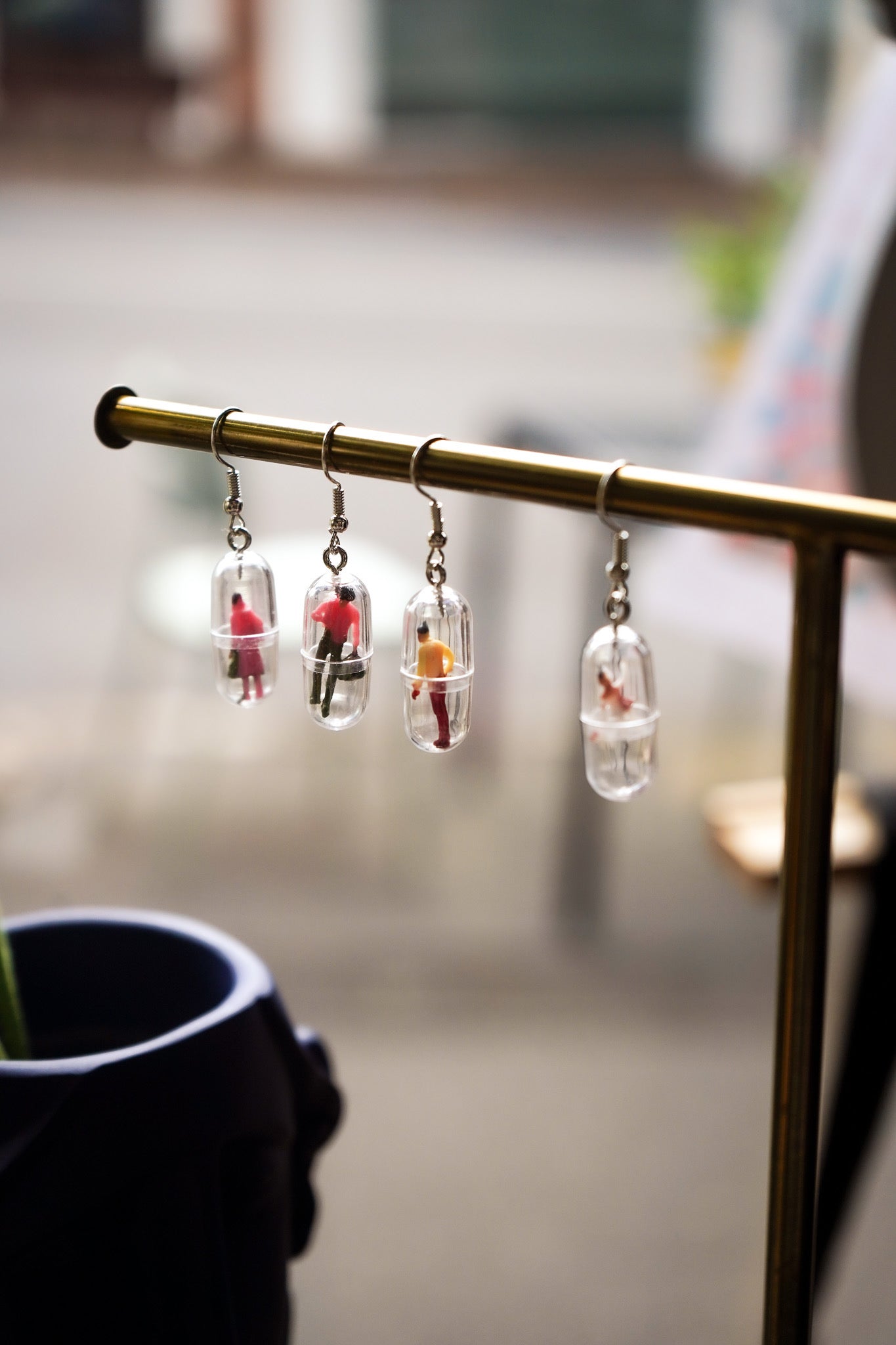 Funky human capsule earrings