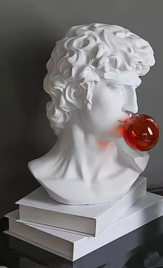 David blowing red bubble statue