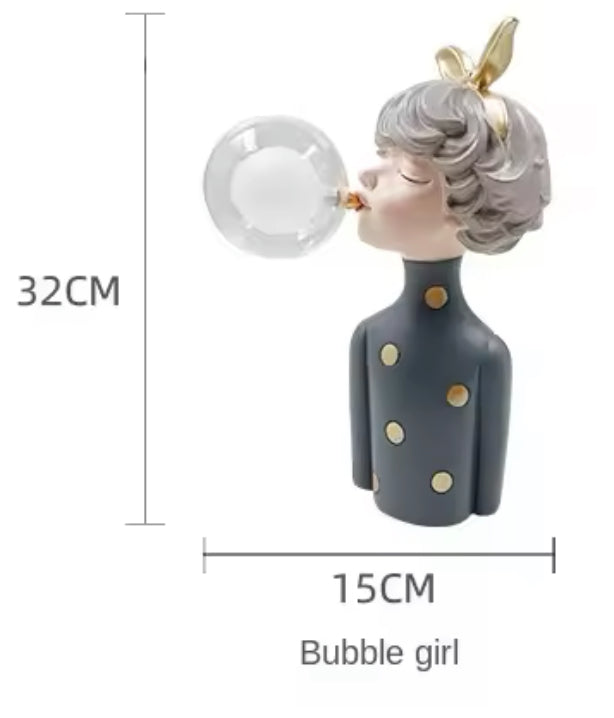 Lampe fille chewing-gum avec pull gris à pois dorés