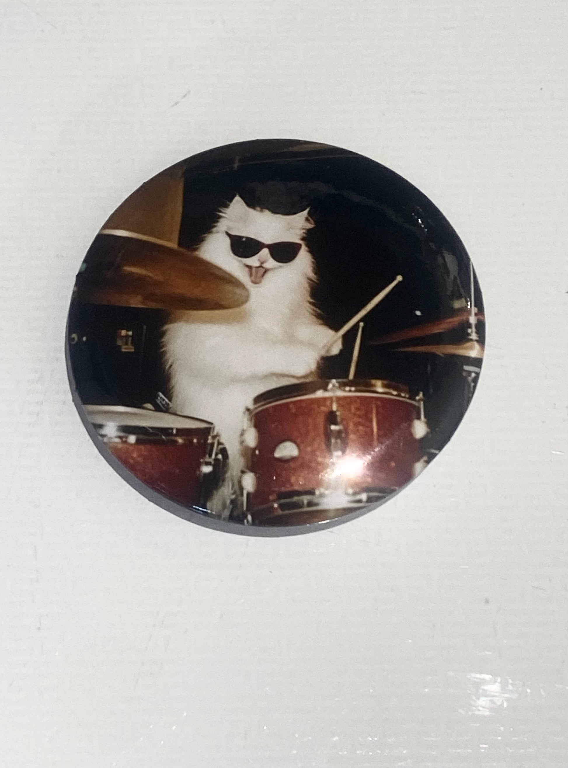 Cat Playing Drums badge