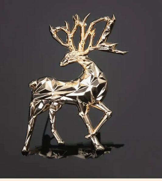 Gold reindeer brooch