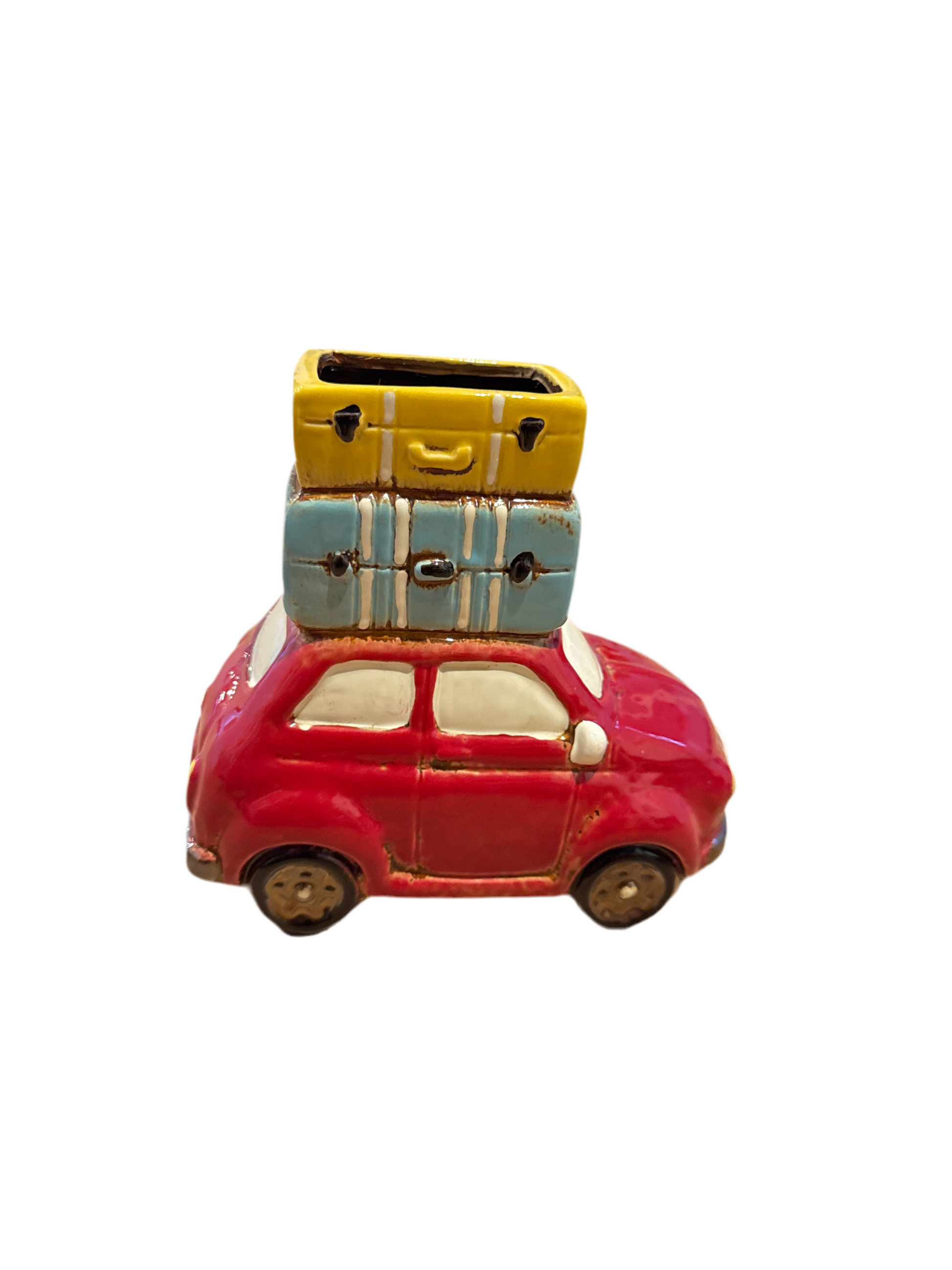 Luggage Piled on Car Planter Pot