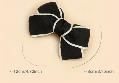 Bow shoe clips with black  ribbon with white edging