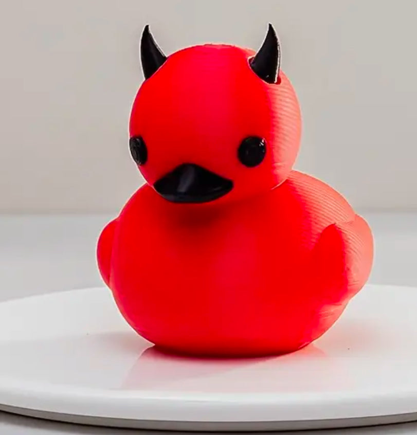 Canard en caoutchouc diable rouge corné