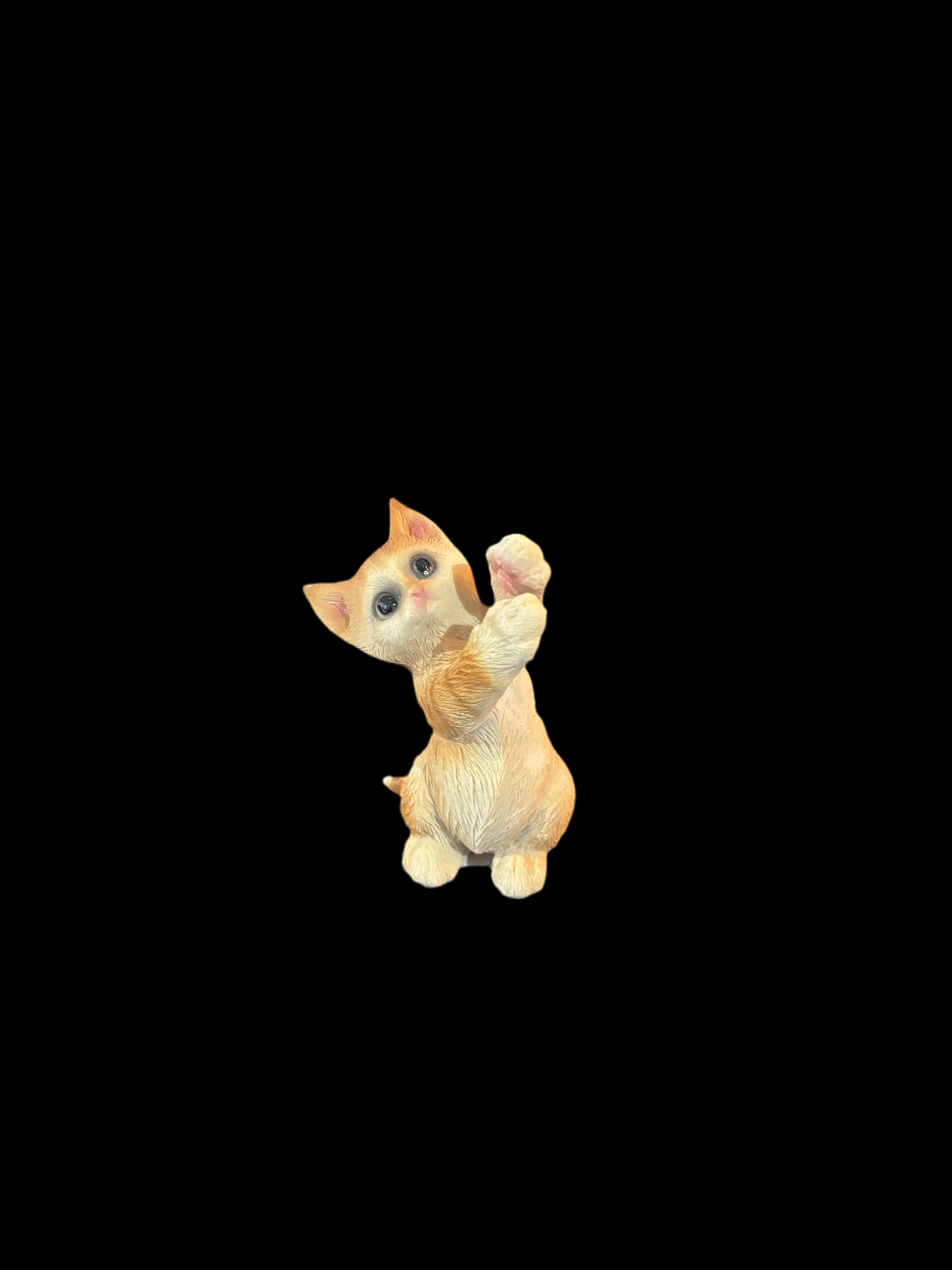 Orange tabby cat figurine