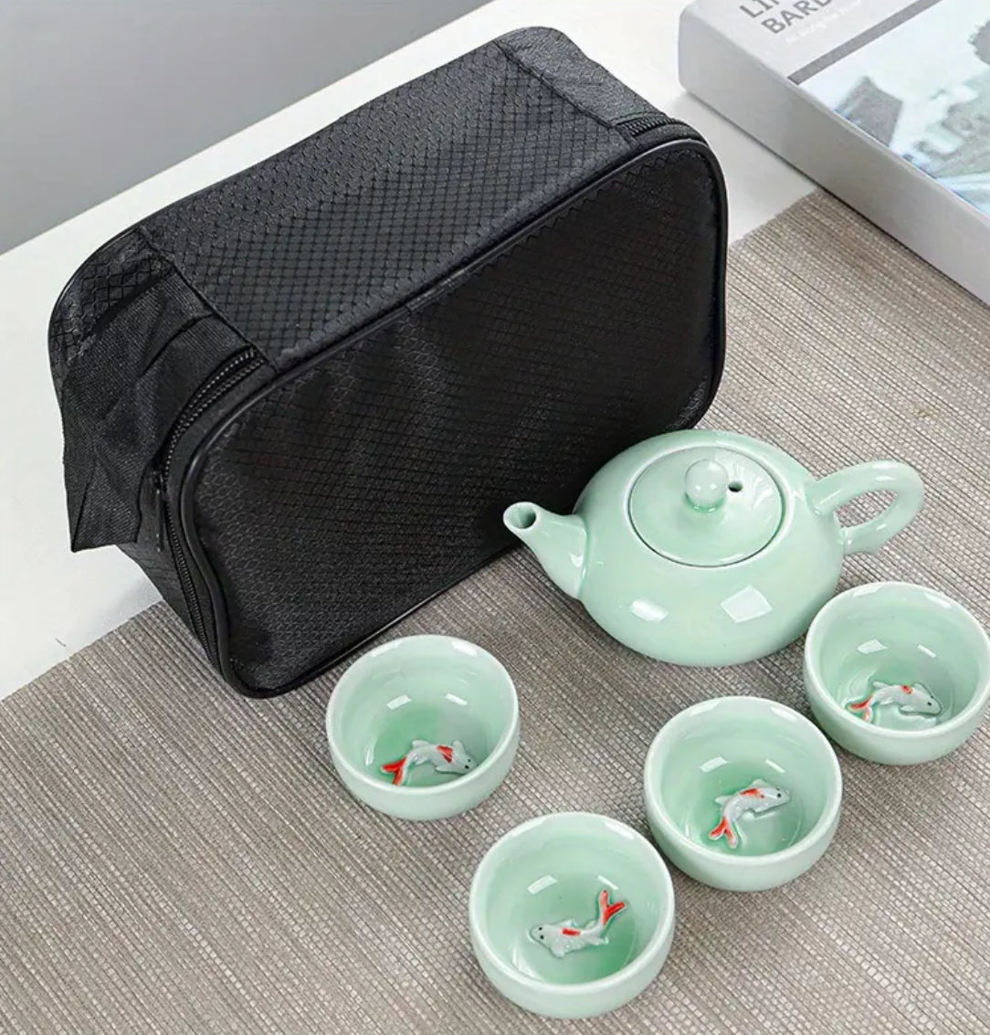 Ceramic teapot and 4 goldfish cups