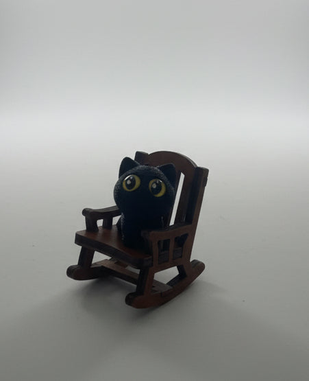 Black cat in Chair