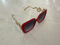Lunettes de soleil à monture en plastique épais rouge avec branches en forme de serpent doré