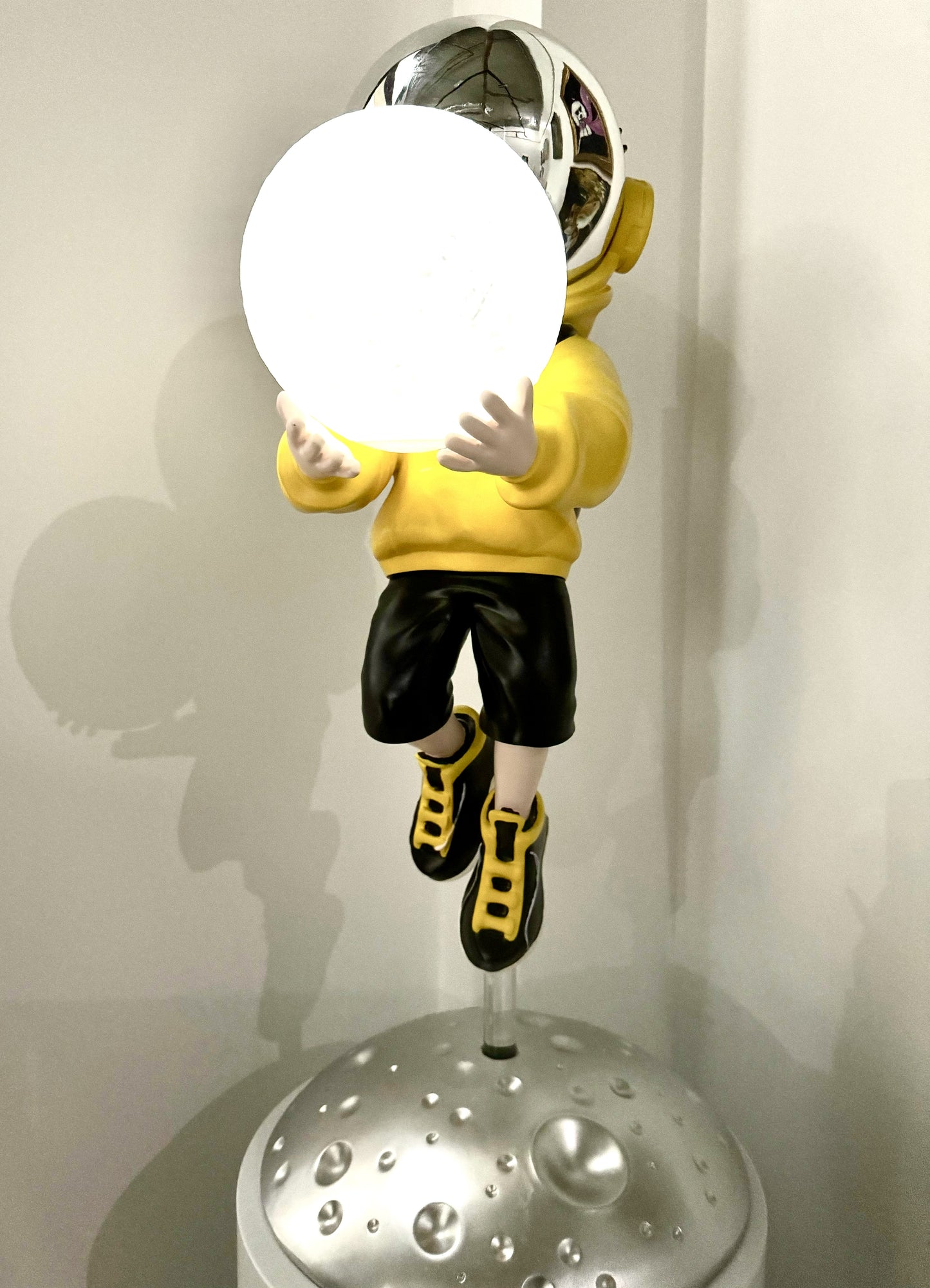 Astronaut in Yellow Sweater with Moon Lamp