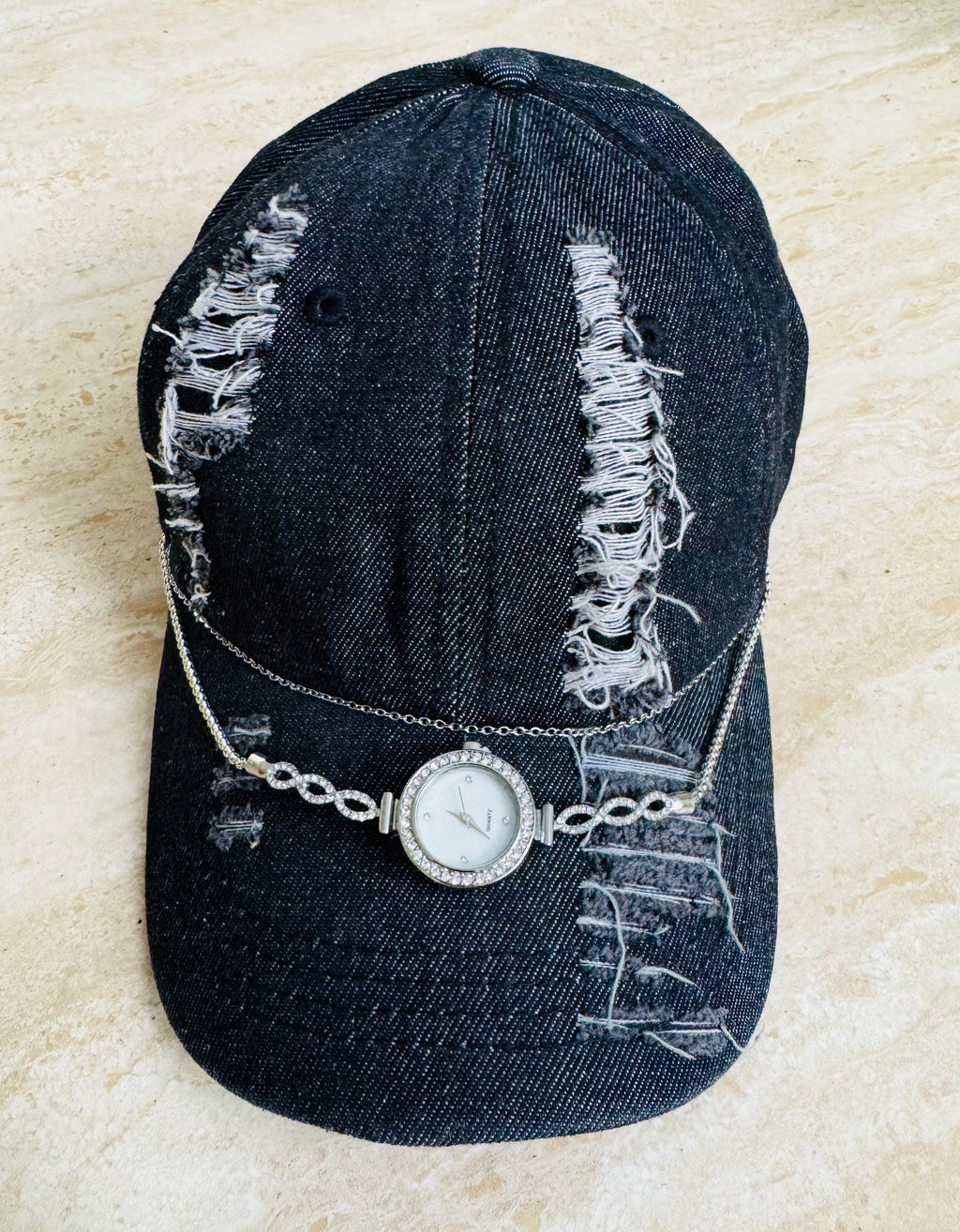 Torn black denim cap