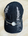 Torn black denim cap