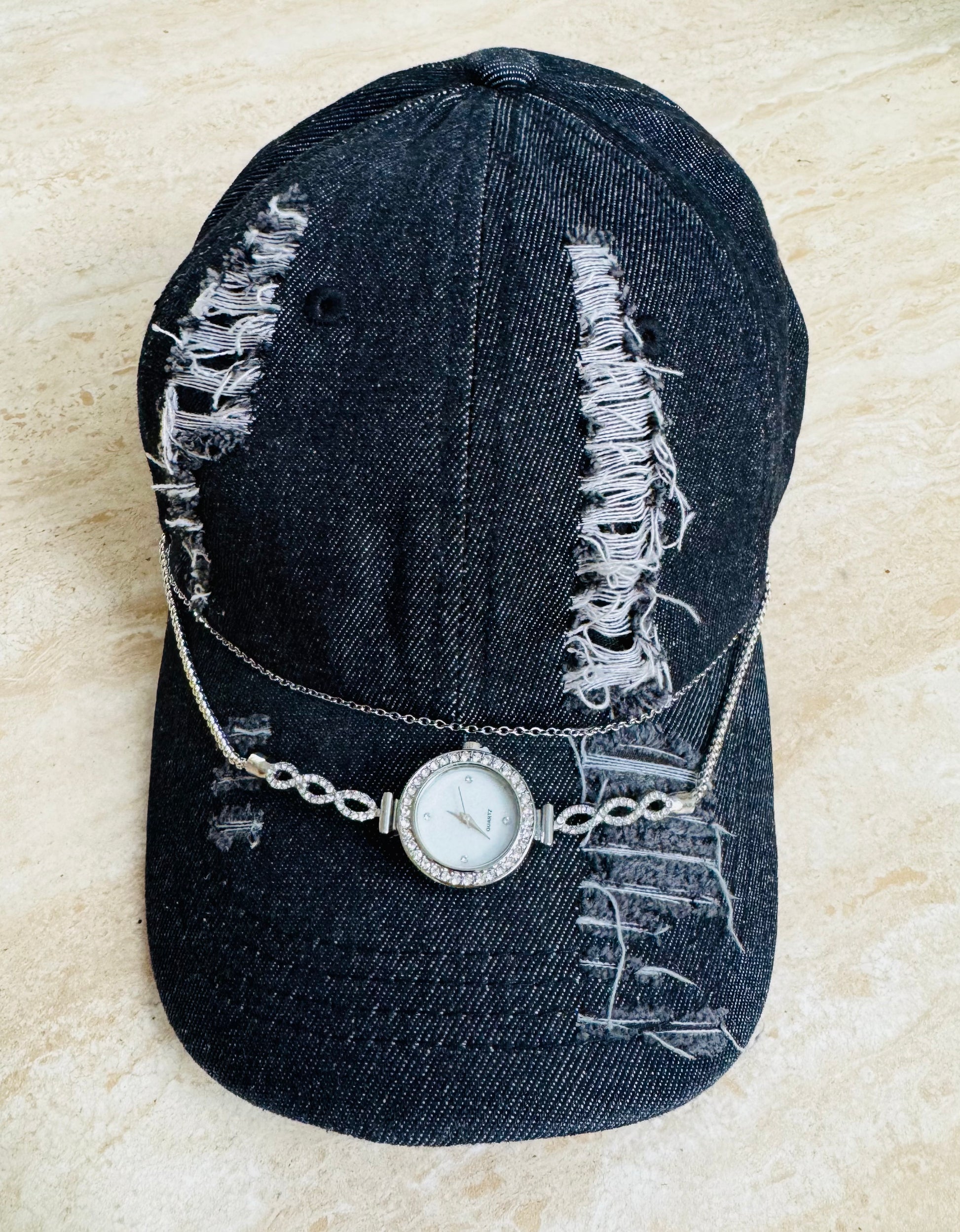 Torn black denim cap