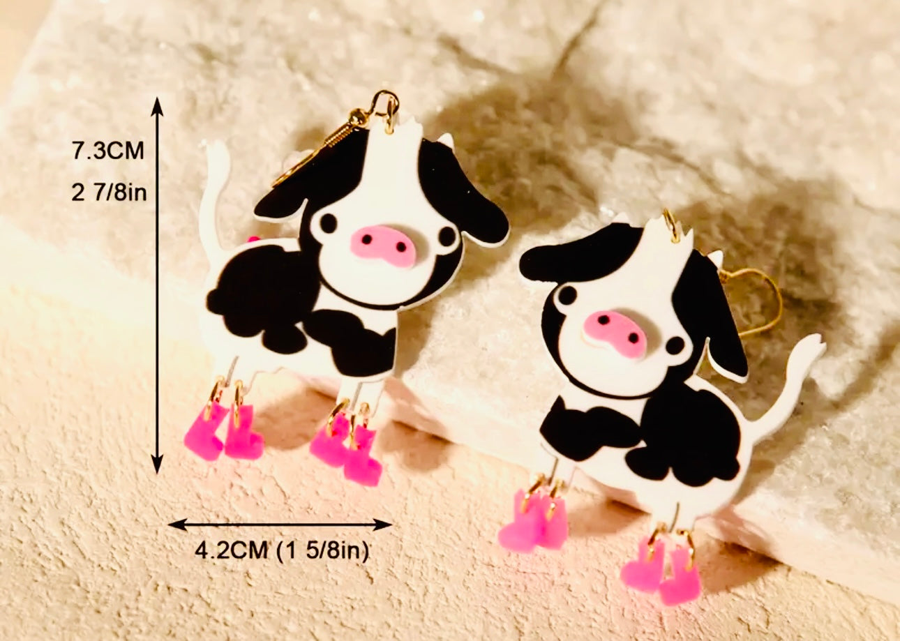 Boucles d'oreilles vache avec des bottes roses
