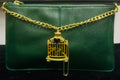 Pochette en cuir vert cage à oiseaux dorée
