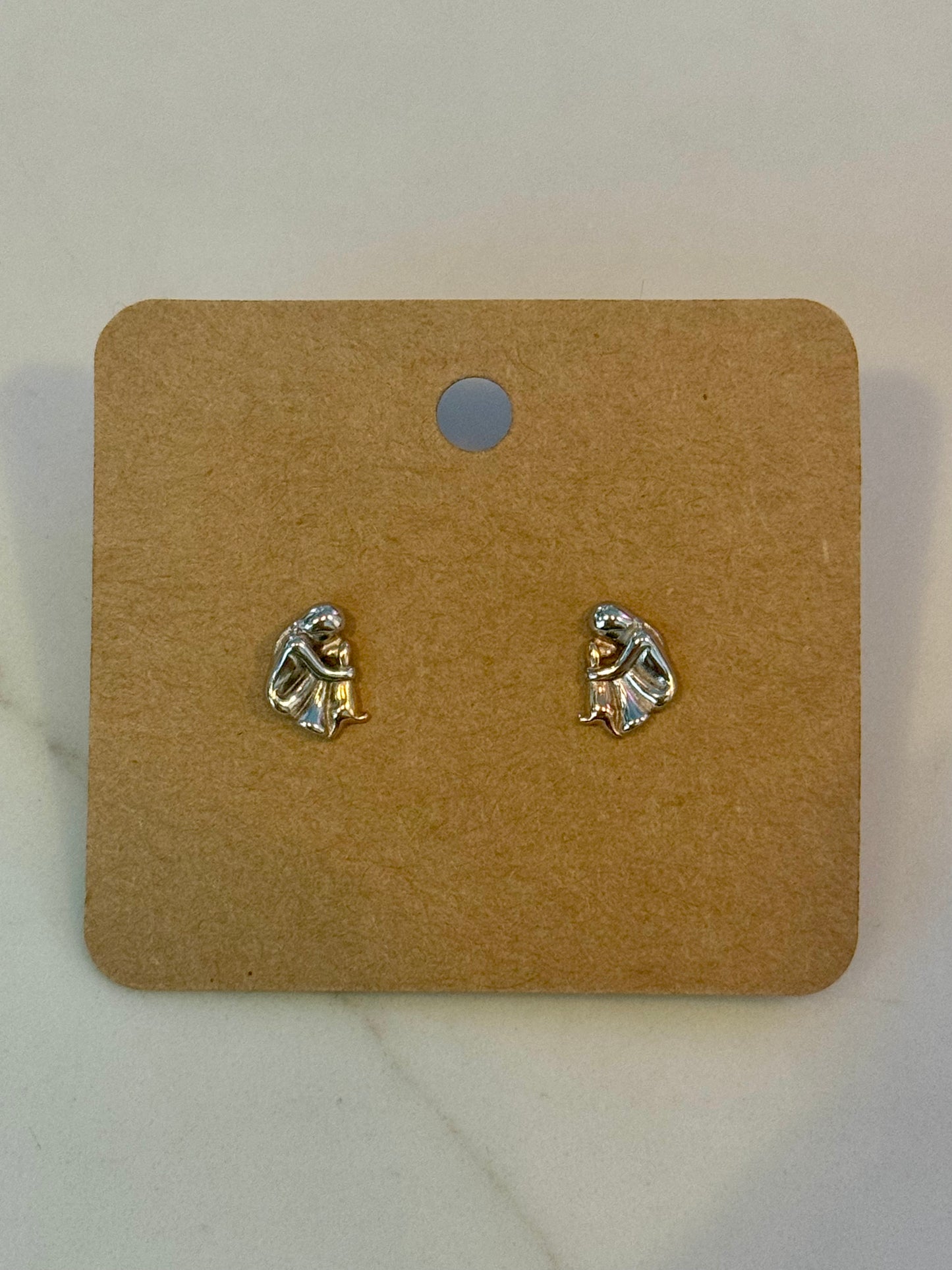 Person hugging dog sterling silver studs