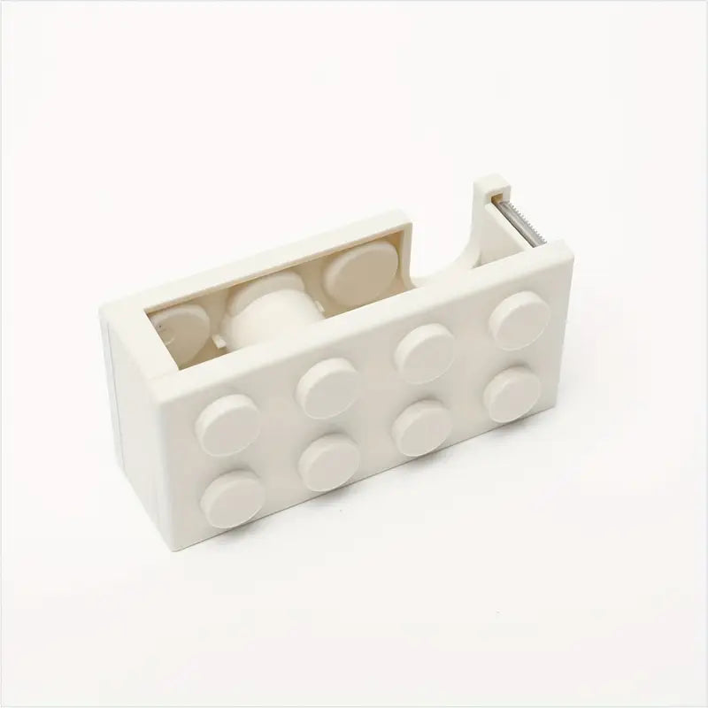 Building block tape dispenser