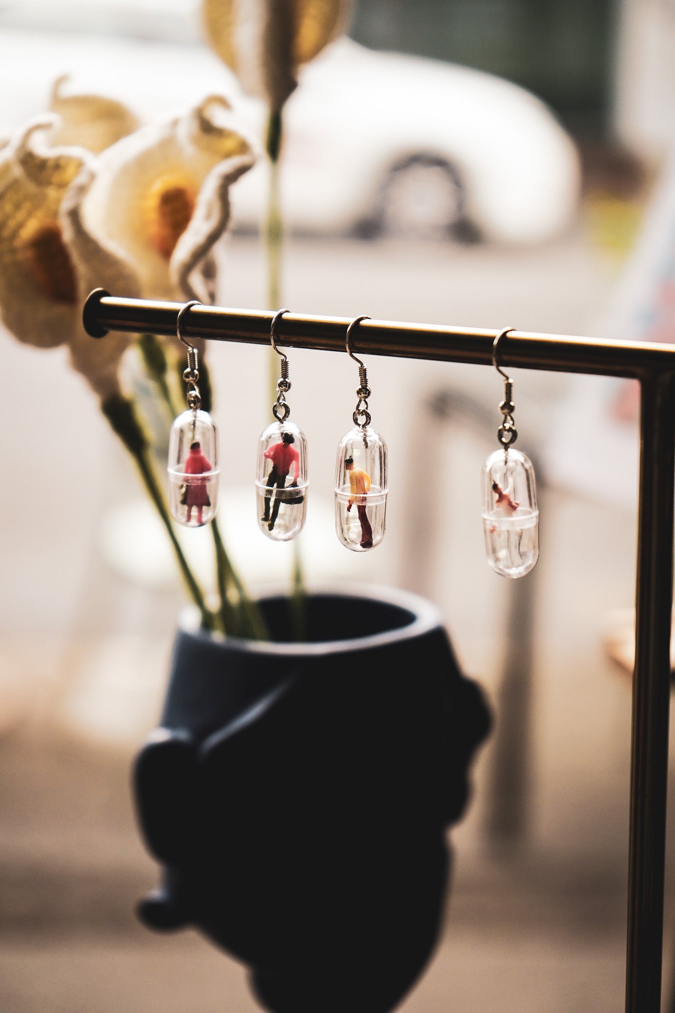 Funky human capsule earrings