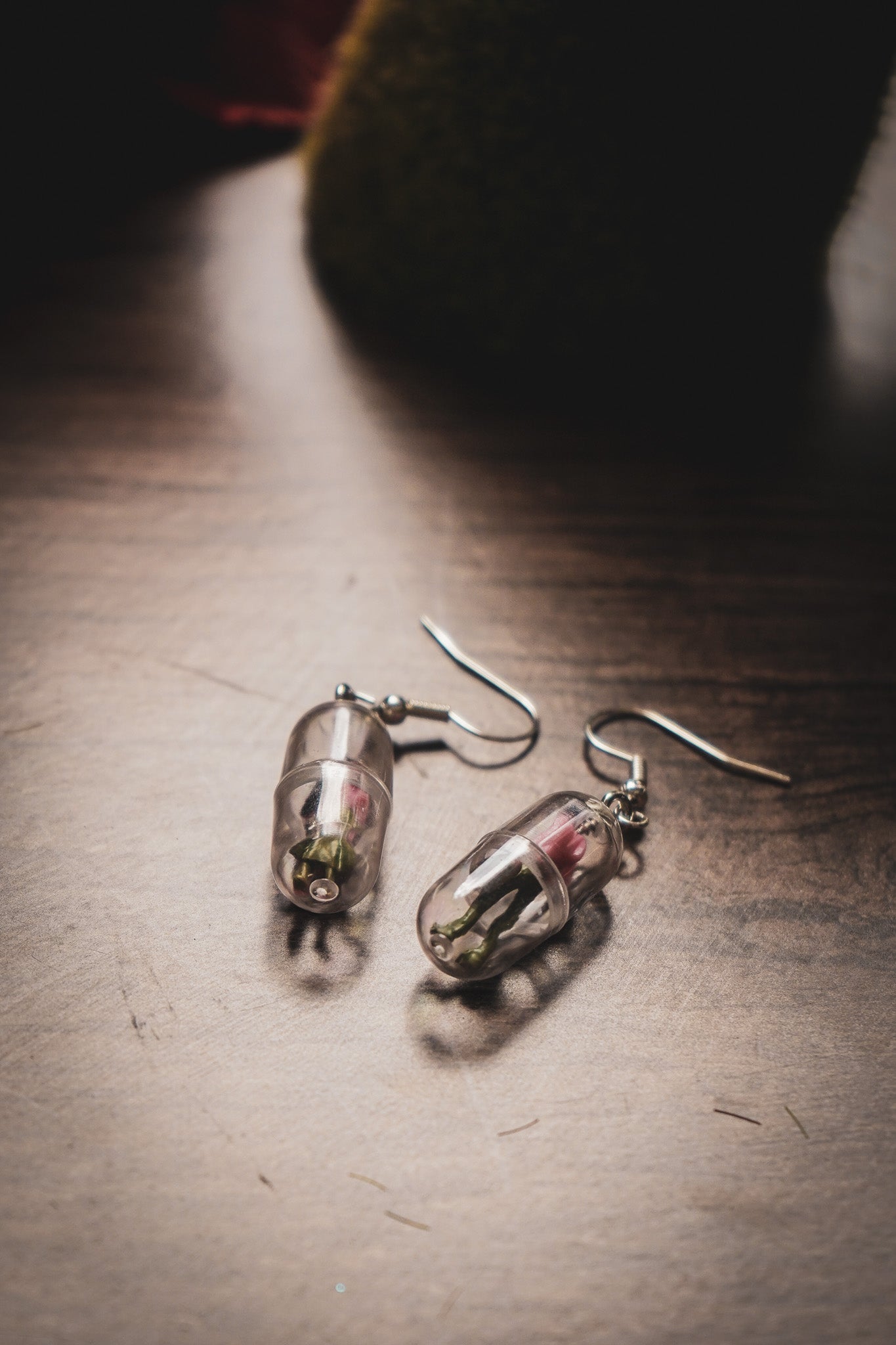 Funky human capsule earrings