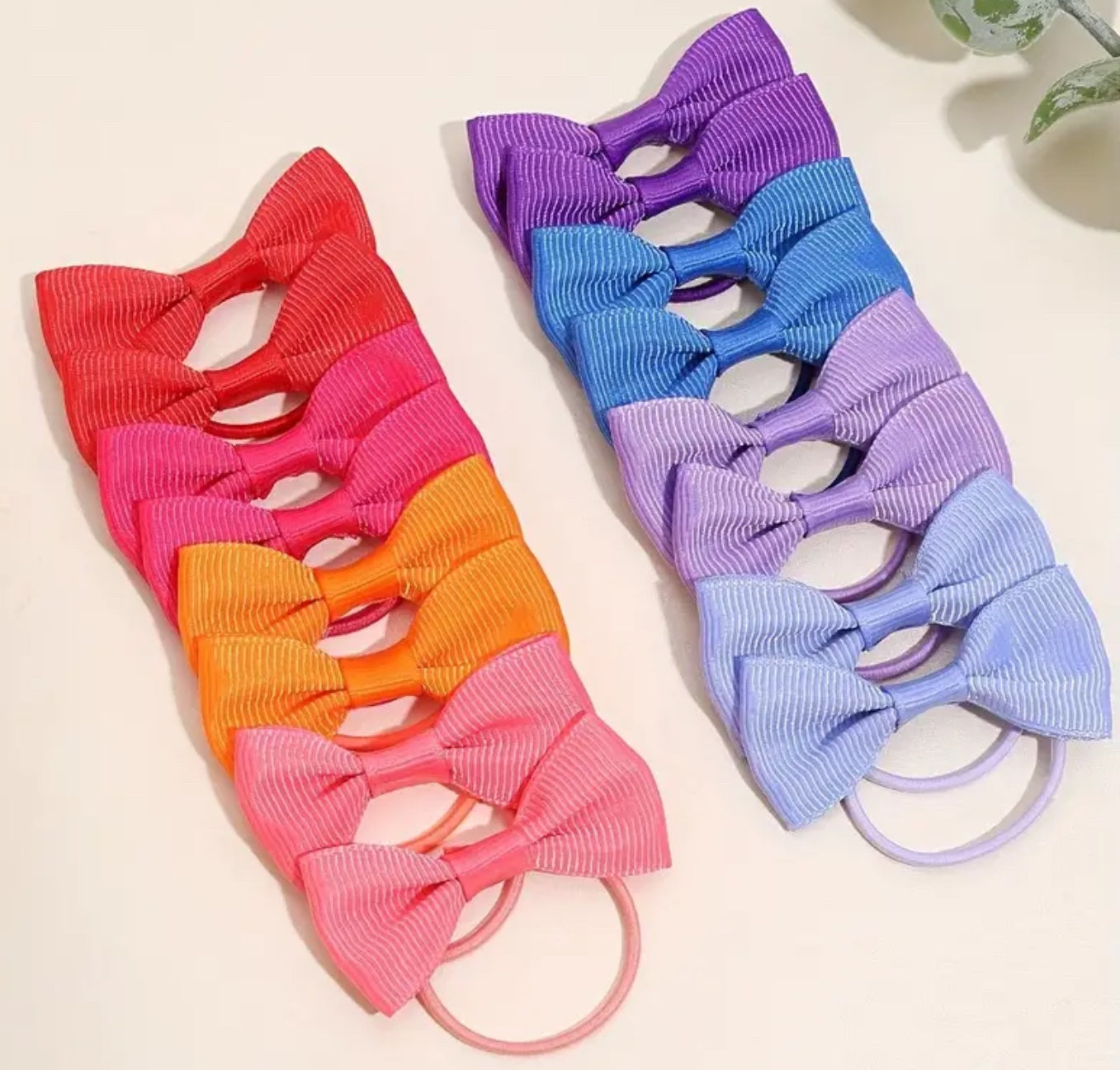 Paire de petits élastiques à cheveux en forme de nœud