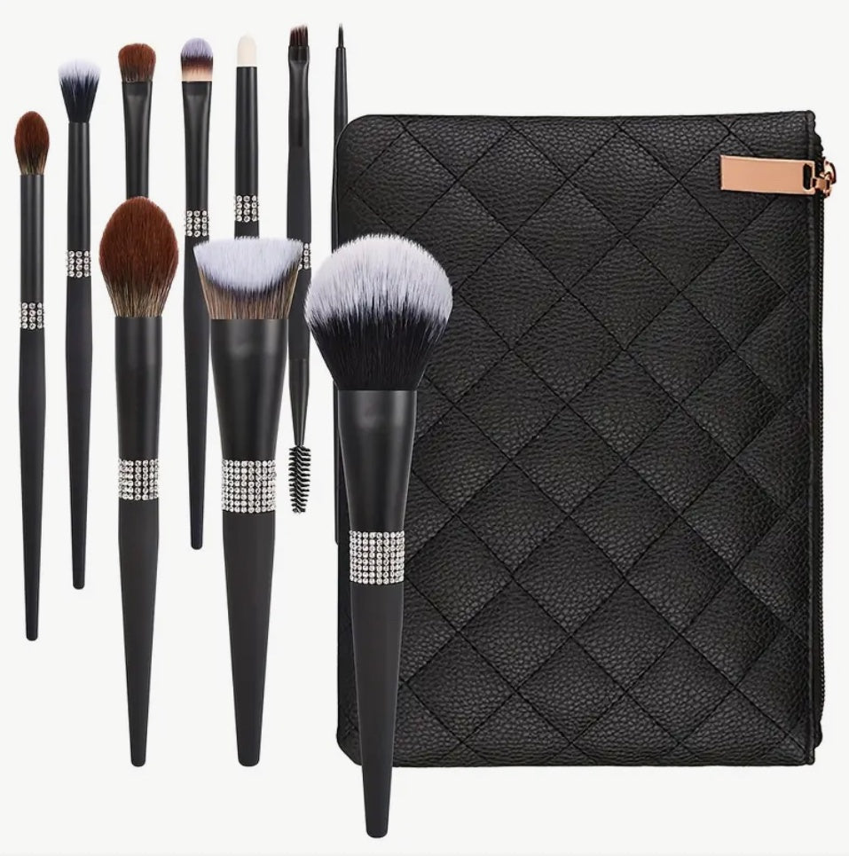 Set of 10 black make-up brushes in quilted case.