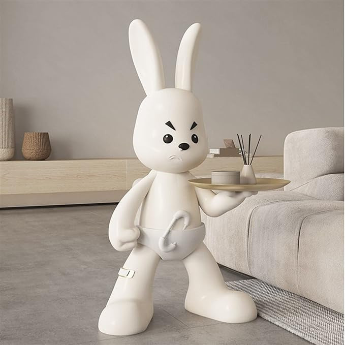 Statue de lapin tenant une assiette