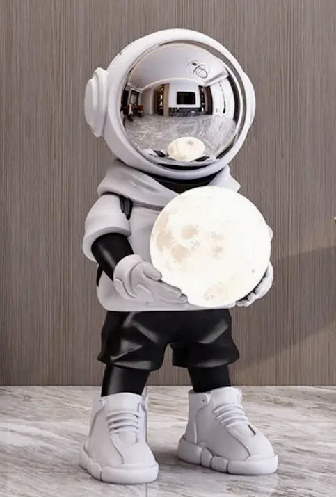 Astronaut holding moon lamp