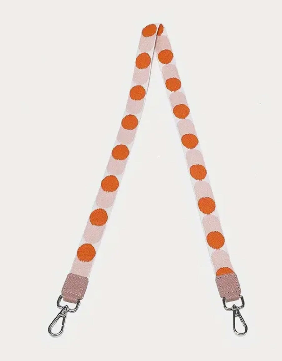 Pink and orange spotted bag strap