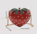 Red strawberry-shaped handbag with gold-tone chain strap