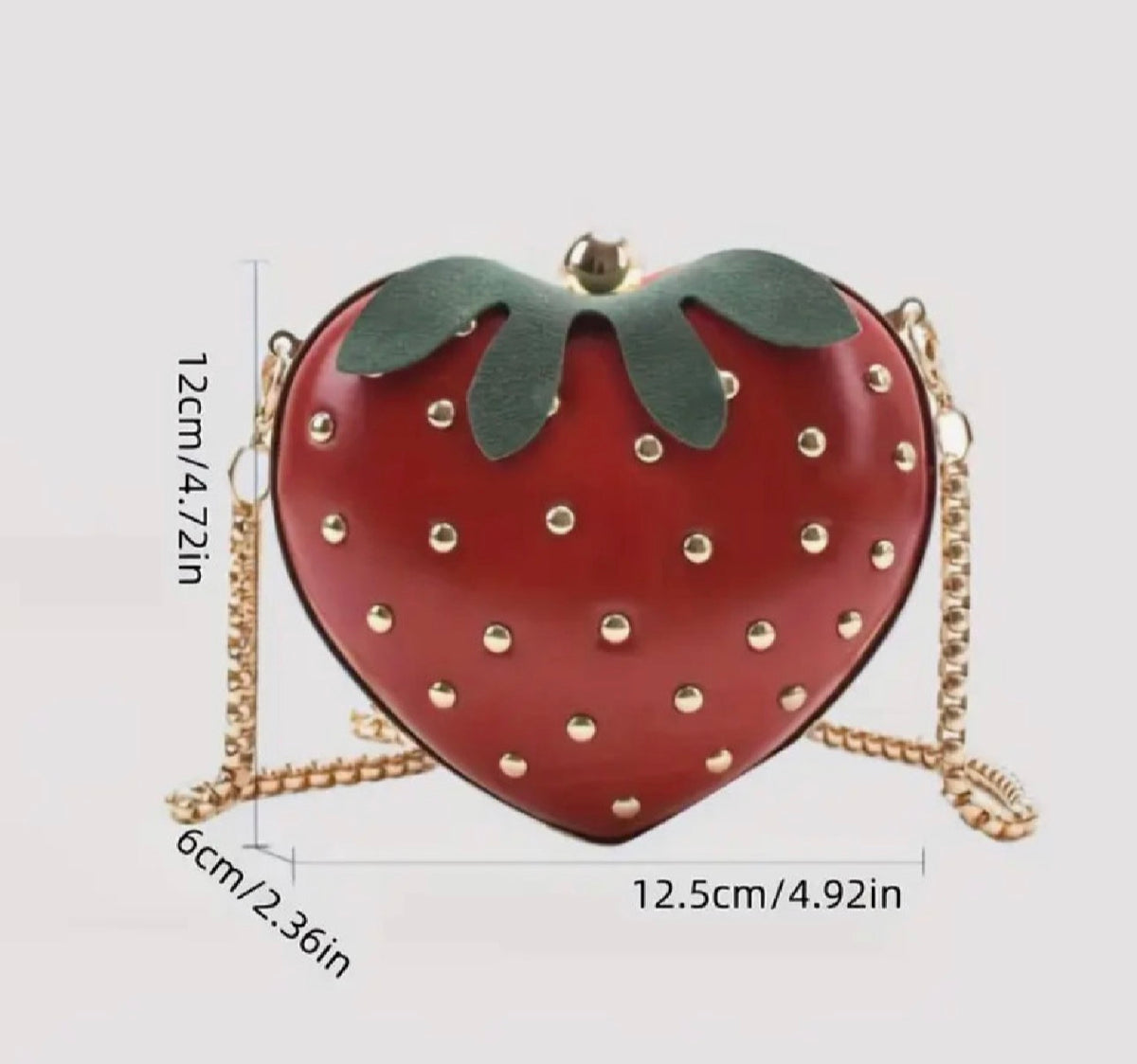 Red strawberry-shaped handbag with gold-tone chain strap