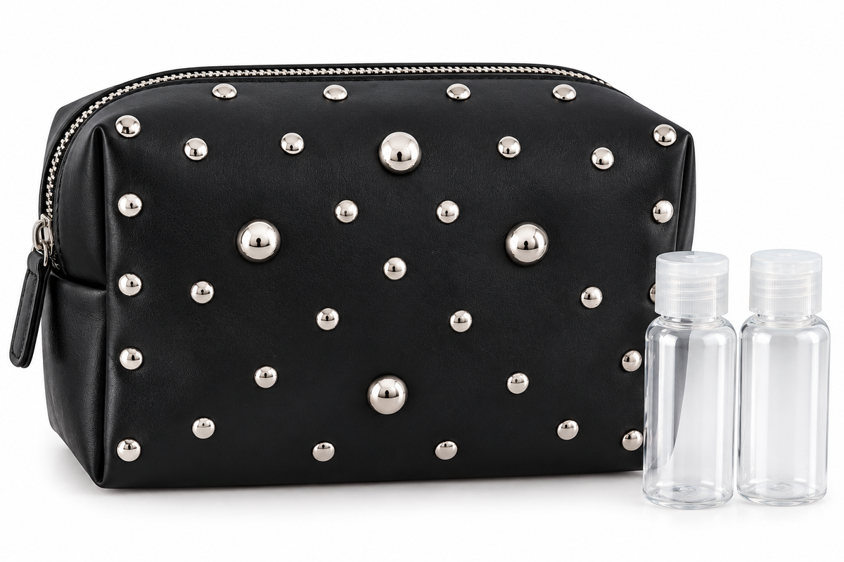 Black studded vinyl toiletry bag with two clear 40 ml bottles on white background
