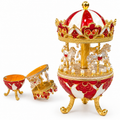 Ornate enamel carousel jewellery box shown closed and open