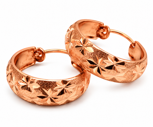 Copper engraved floral hoop earrings on white background