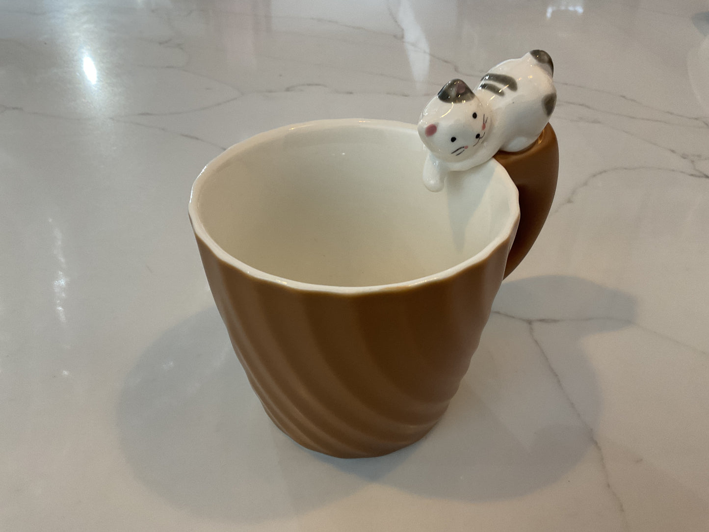 3D mug with cat sitting on handle