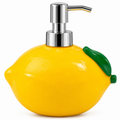 Lemon-shaped resin soap dispenser white background