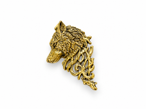 Old wolf gold-tone alloy pin on white studio background, 5 cm