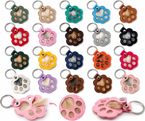 Colourful paw-shaped pet fur keepsake keychains filled with different coloured fur