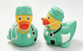 Resin surgeon doctor duck figurine in green scrubs with stethoscope